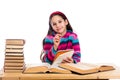 Creative girl with pile of books