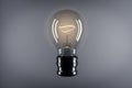 Creative glass light bulb with reflections and mock up place on gray background. Idea, success and innovation concept. 3D
