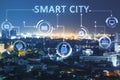 Creative glowing night smart city backdrop with interface and downtown. Technology, innovation and urbanization concept. Double