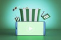 Creative green online movie theater background with smartphone, pop corn and other items. Multimedia application service. 3D