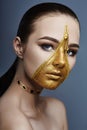 Creative grim makeup face of girl Golden color zipper clothing on skin. Fashion beauty creative cosmetics and skin care halloween Royalty Free Stock Photo