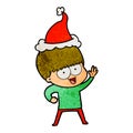 A creative happy textured cartoon of a boy wearing santa hat