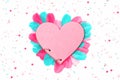 Creative heart notepad with colorful feathers, flat lay Royalty Free Stock Photo