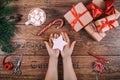 Creative hobby. Woman's hands show christmas holiday handmade Christmas tree toy. Scissors on wooden table, top view Royalty Free Stock Photo