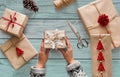 Woman`s hands holding christmas holiday present decorated with snowflake Royalty Free Stock Photo