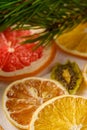 Creative holiday Christmas New Year food fruit texture with dried grapefruit, kiwi, orange and lemon with branch of fir tree Royalty Free Stock Photo