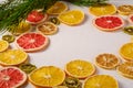 Creative holiday Christmas New Year food fruit texture with dried grapefruit, kiwi, orange and lemon with branch of fir tree Royalty Free Stock Photo