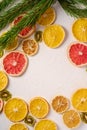 Creative holiday Christmas New Year food fruit texture with dried grapefruit, kiwi, orange and lemon with branch of fir tree Royalty Free Stock Photo