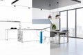 Creative home repairs concept with roller in modern kitchen interior.