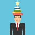A creative idea came to mind. Search for a creative idea. Light bulb with books on a man`s head. Startup