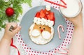 Creative idea for Christmas kid breakfast - funny santa pancake Royalty Free Stock Photo