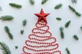 A Christmas tree made of beads and a star on top. Celebratory concept. Royalty Free Stock Photo