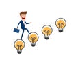 Creative idea concept. Businessman in suit holding briefcase walking on stairs made of light bulb idea