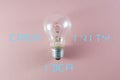 Creative idea and innovation concept via lit bulb on pink background and relevant text Royalty Free Stock Photo