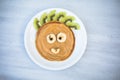 Creative idea for kids breakfast. Bear shaped pancakes with berries on marble  table, top view. Healthy food for children. Funny Royalty Free Stock Photo