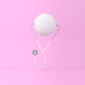 Creative idea layout golf concept with stethoscope on pink paste