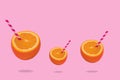 Creative idea made of fresh fruit - orange half with straws on orange background Royalty Free Stock Photo