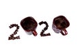 A creative idea of making 2020 number of two cups of coffee and coffee beans Royalty Free Stock Photo