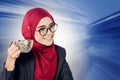 Successful young muslimah businesswomen over abstract double exposure background Royalty Free Stock Photo