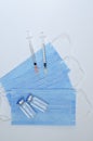 Creative ideas of diabetes concept. Insulin injection. Fighting with allergy. Top view of syringes with medical masks and vaccine. Royalty Free Stock Photo