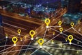 Creative illuminated night city background with digital map pointer connections. Smart city concept