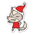 angry wolf sticker cartoon of a wearing santa hat