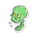 retro distressed sticker of a cartoon laughing skull