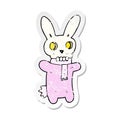 retro distressed sticker of a cartoon spooky skull rabbit