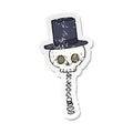 retro distressed sticker of a cartoon spooky skull in top hat