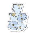 retro distressed sticker of a cartoon stack of dirty coffee cups