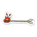 sticker of a cartoon flaming arrow