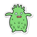 sticker of a cartoon funny slime monster