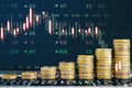 Creative image of growing coin stacks and candlestick forex chart on blurry backdrop. Trade, money and financial growth concept. Royalty Free Stock Photo