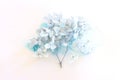 Creative image of pastel blue Hydrangea flowers on artistic ink background. Top view with copy space Royalty Free Stock Photo