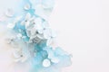 Creative image of pastel blue Hydrangea flowers on artistic ink background. Top view with copy space Royalty Free Stock Photo