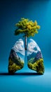 A tree growing out of the lungs of a man with mountains in the background Royalty Free Stock Photo