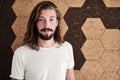 Creative individual entrepreneur standing in front of cork wall