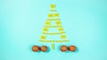 The creative installation show Christmas tree made of pasta. Tomatoes mean red gift boxes decorated with green string Royalty Free Stock Photo