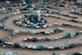 Traditional natural stone labyrinth maze made for contemplation and worship, created with rocks in shades of blue and turquoise