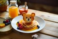 Creative kids meals. Children's breakfast pancakes smiling face of the teddy bear strawberry blueberry , cute food