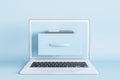 Creative laptop with abstract folder on screen on blue background. Digital transformation and archive concept.