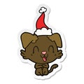 A creative laughing sticker cartoon of a dog wearing santa hat