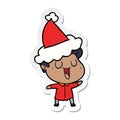 A creative laughing sticker cartoon of a man wearing santa hat