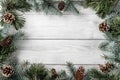 Creative layout frame made of Christmas tree branches and pine cones on white background. Xmas and New Year theme. Royalty Free Stock Photo