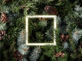Creative layout made of Christmas tree branches with pine cones and glowing neon frame. Xmas and New Year theme. Flat lay, Royalty Free Stock Photo