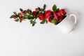 Creative layout made of coffee or tea cup with red roses on white background Royalty Free Stock Photo