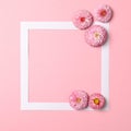 Creative layout made of colorful spring flowers and paper frame border. Minimal holiday concept. Flat lay pattern Royalty Free Stock Photo