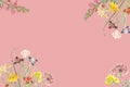 Creative layout made of colorful tropical flowers on pink background. Royalty Free Stock Photo