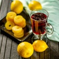 Creative layout made of cup of hibiscus tea and lemon on a table background. Top view. Royalty Free Stock Photo