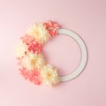 Creative layout made with flowers and white circle frame. Summer and spring minimal concept. Nature background. Royalty Free Stock Photo